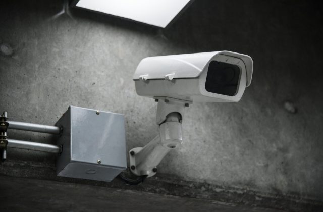 closeup-cctv-camera-wall-min